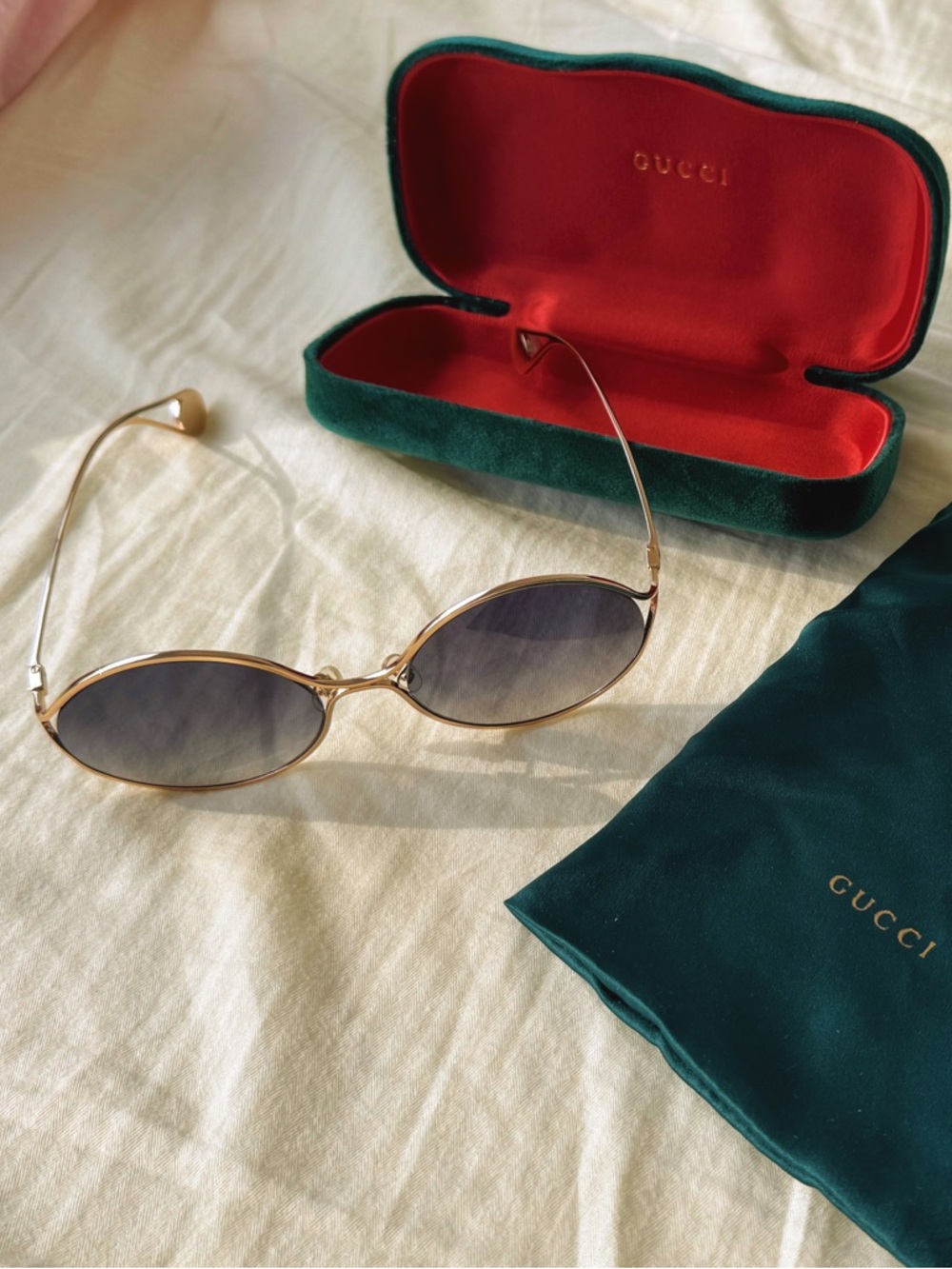Gucci Women's Gold Oval Sunglasses with Green Case GG0253S